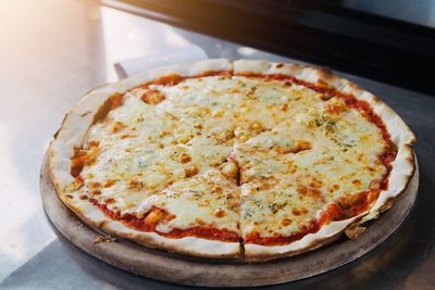 High angle view of pizza in plate on table