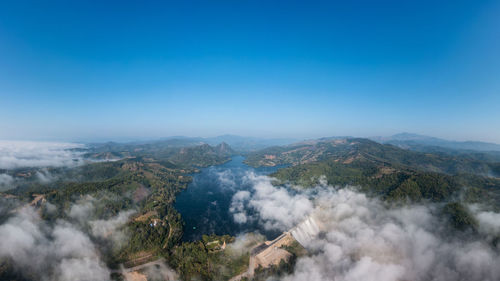Beautiful panoramic landscape aerial view mae suai dam or reservoir and fog with blue sky background