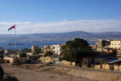 View of the city of aqaba with the flag