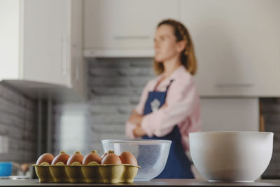 Woman preparing food in kitchen at home