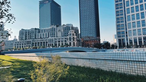 Modern buildings in city against sky