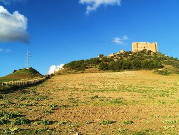 Built structure on land against sky