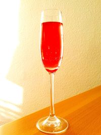 Close-up of red wine in glass on table