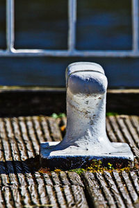 Bollard on retaining wall