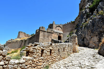 Low angle view of historic building against blue sky