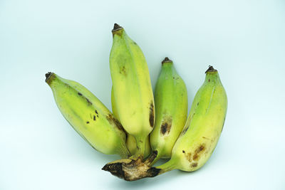 Close-up of bananas against white background