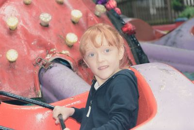 Portrait of smiling girl playing outdoors
