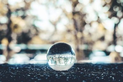 Close-up of crystal ball on glass
