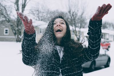 Full length of young woman in snow