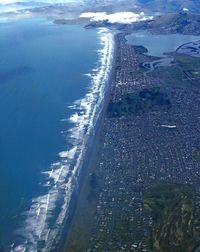 High angle view of sea and city