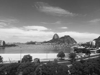 View of bay against cloudy sky