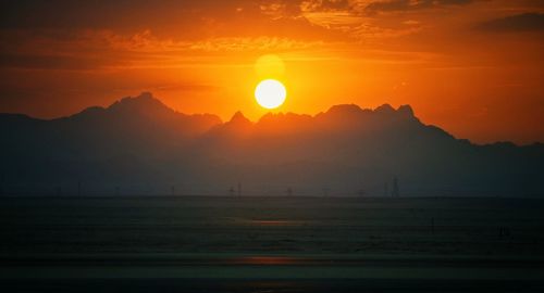 Scenic view of silhouette landscape against sky during sunset