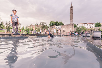 People walking on water in city