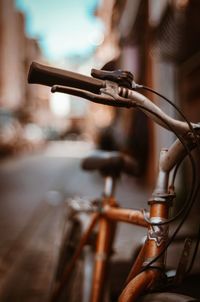 Close-up of bicycle parked in row