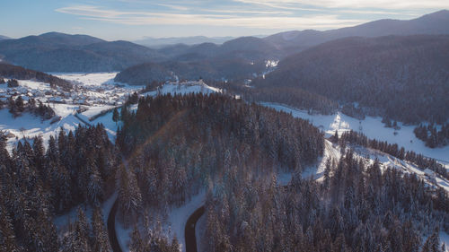 Panoramic view of snowcapped mountains against sky