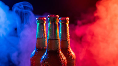 Close-up of glass bottles on table