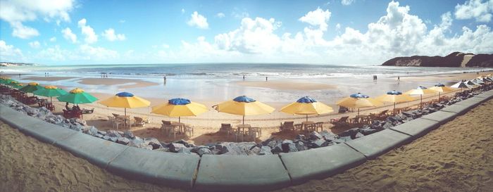 Scenic view of sea against cloudy sky