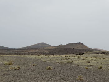 Scenic view of arid landscape against clear sky