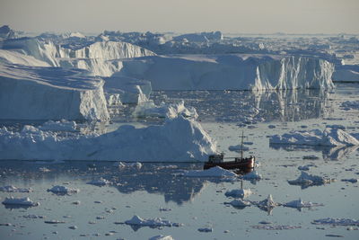 Scenic view of sea against sky during winter