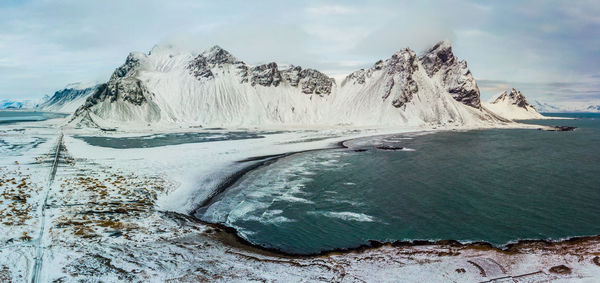 Scenic view of frozen lake against sky