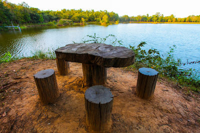 Gazebo by lake against sky