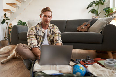 Woman using laptop at home