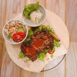 High angle view of rib barbecue and coleslaw on plate