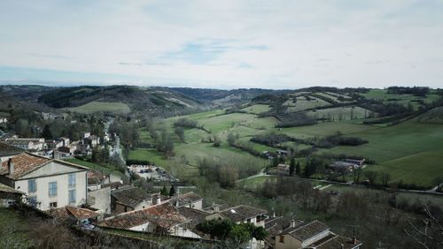 High angle view of houses and trees against sky