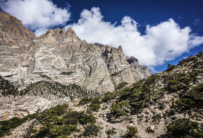 Low angle view of rocks against sky