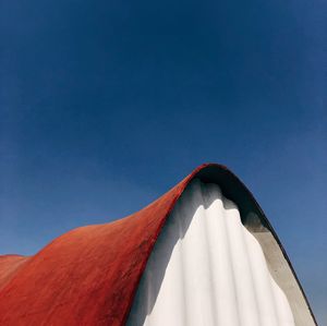 Low angle view of tent against clear blue sky