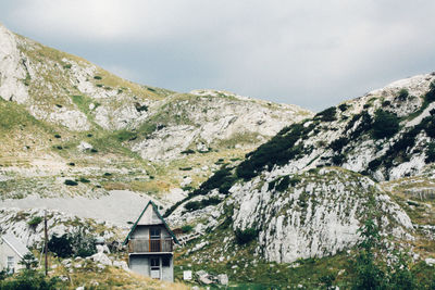 Houses on mountain against clear sky