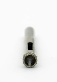 Close-up of cigarette over white background