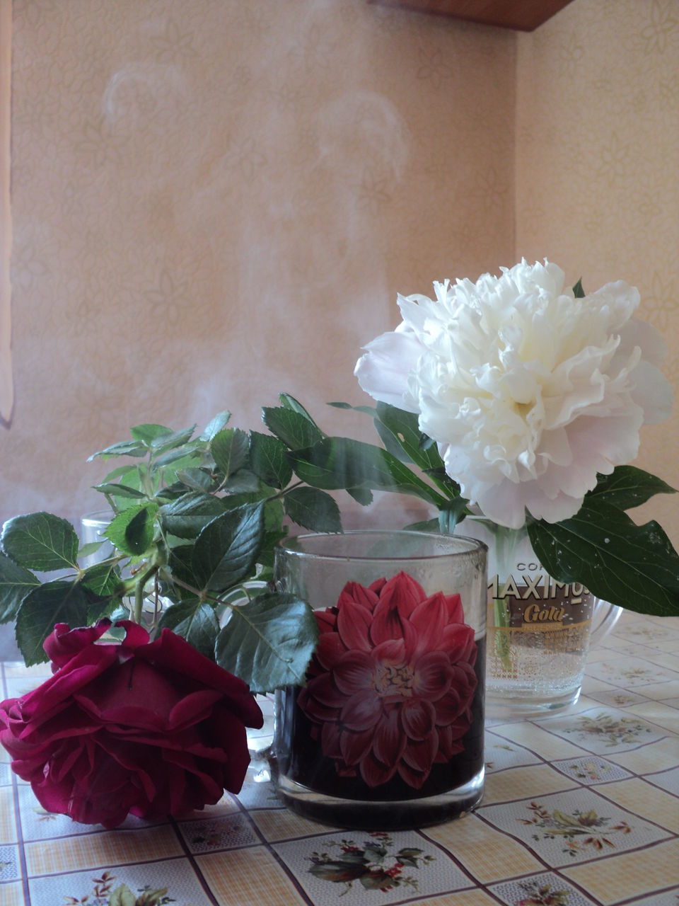 CLOSE-UP OF ROSE BOUQUET ON TABLE