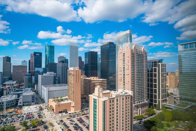 Modern buildings in city against sky