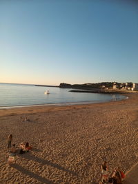 Scenic view of beach against clear sky