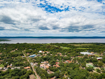 Scenic view of sea and buildings against sky