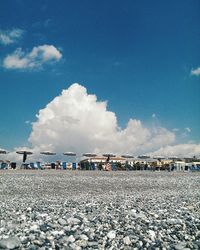 Scenic view of beach against blue sky