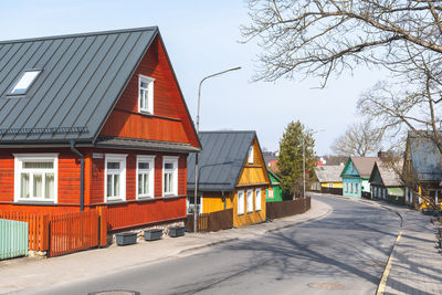 Old lithuanian traditional green wooden houses with three windows in trakai, vilnius district