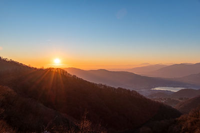 Scenic view of mountains against sky during sunset