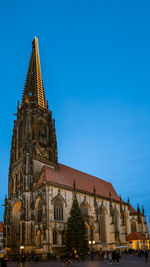 Low angle view of building against clear blue sky
