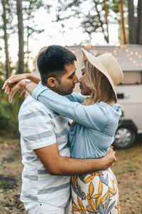 Married asian couple in love travel by camper car on a road trip in nature on their honeymoon