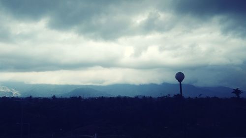 Scenic view of silhouette landscape against sky at dusk