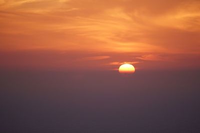 Scenic view of sea against romantic sky at sunset