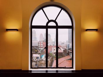 Buildings seen through glass window