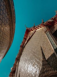 Low angle view of temple against clear blue sky