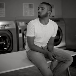 Young man sitting at home