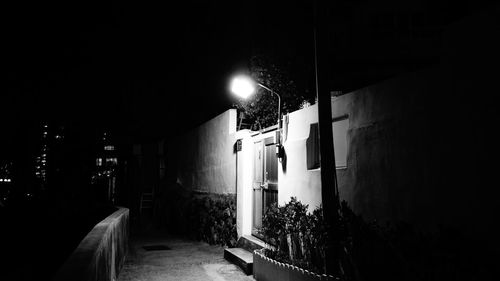 View of illuminated street lights at night