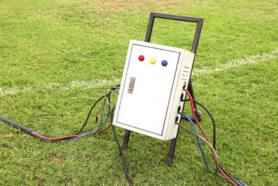 High angle view of telephone booth on field