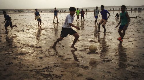 Group of people standing on beach