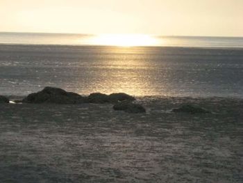 Scenic view of sea at sunset